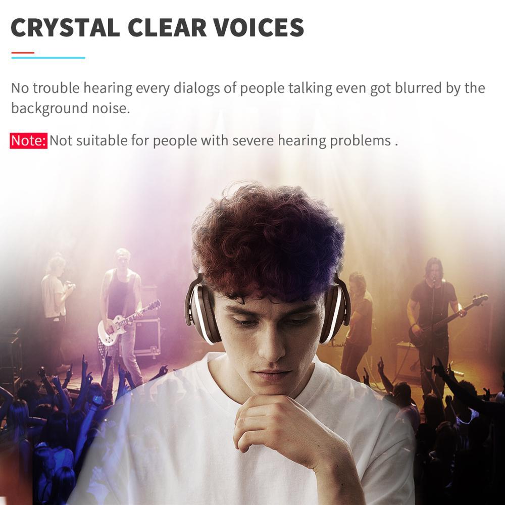 Young man wearing wireless headphones enjoying crystal clear audio amid a lively concert background.