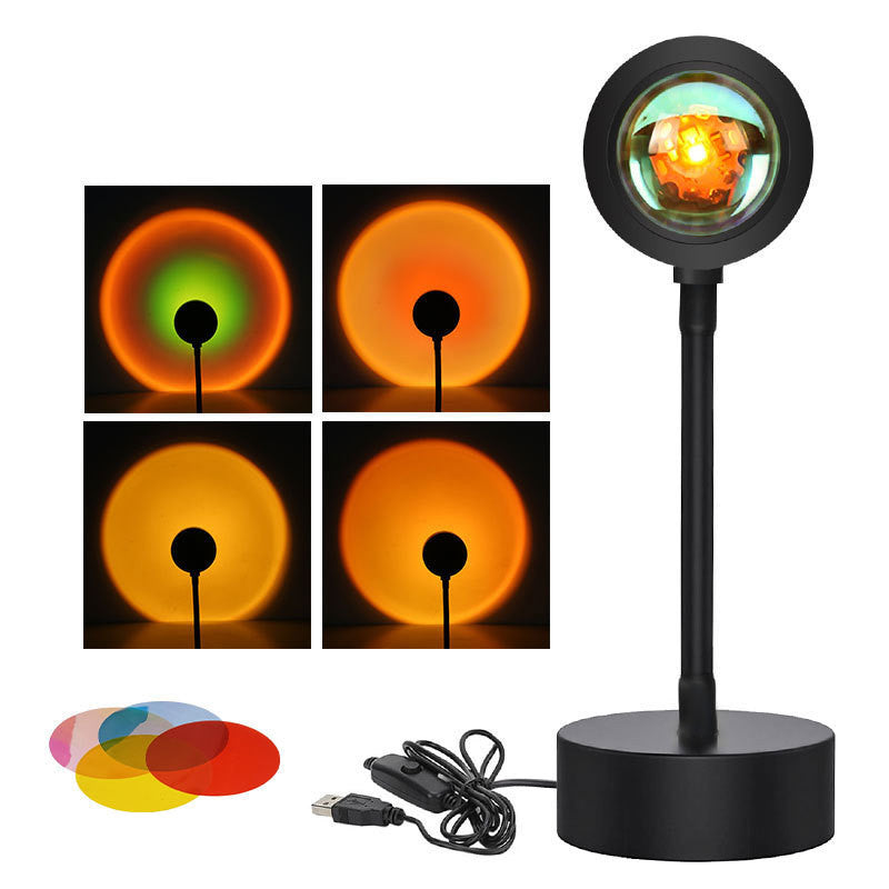 Sunset projection lamp casting warm colors, showcasing remote control and various light effects for cozy ambiance.