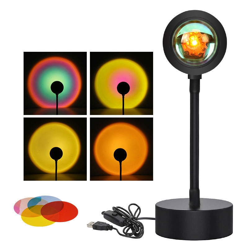 Sunset projection lamp casting warm colors, showcasing remote control and various light effects for cozy ambiance.