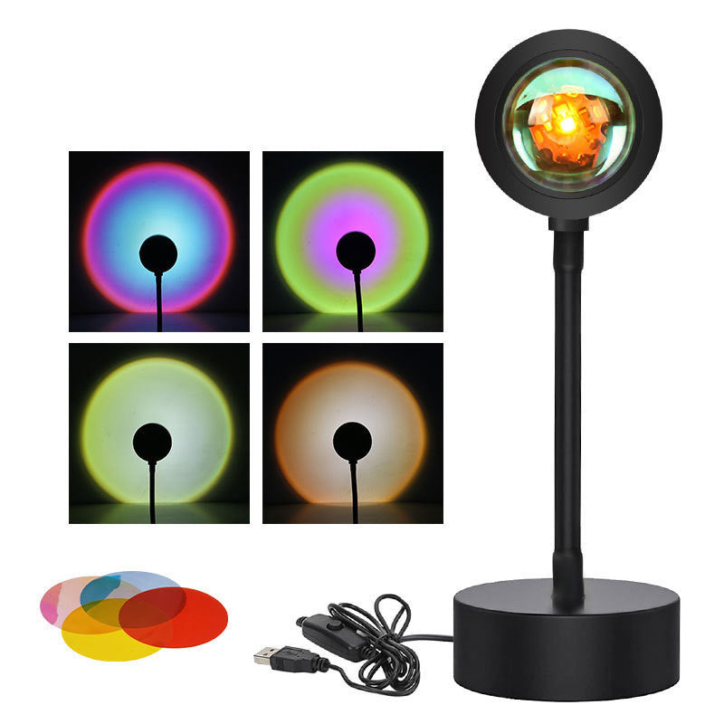 Sunset projection lamp casting warm colors, showcasing remote control and various light effects for cozy ambiance.