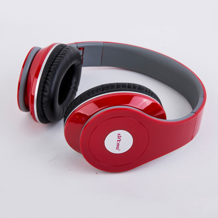 Heavy bass wired gaming headphones in red with cushioned ear cups for immersive gaming experience.