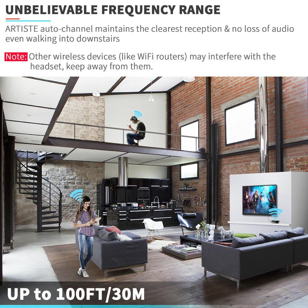 An open-concept living room showcasing wireless headphones with a range of up to 100FT, featuring clear audio reception.