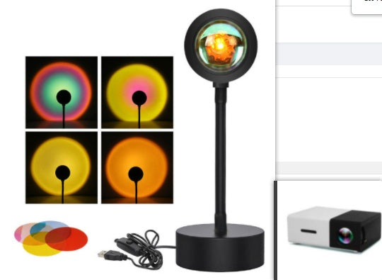 Sunset projection lamp casting warm colors, showcasing remote control and various light effects for cozy ambiance.